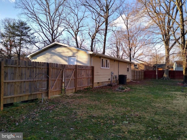 exterior space featuring crawl space, fence, central AC, and a yard