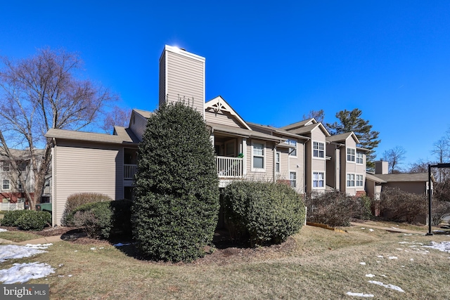 view of home's exterior with a yard