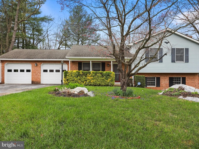 374 Tuscawilla Dr, Charles Town, WV 25414 - view of front of home with a garage, a front yard, aphalt driveway, and brick siding