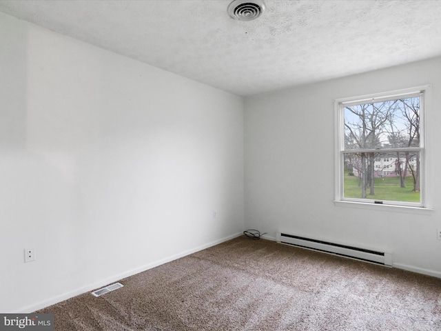 374 Tuscawilla Dr, Charles Town, WV 25414 - spare room featuring carpet flooring, visible vents, a baseboard radiator, and baseboards