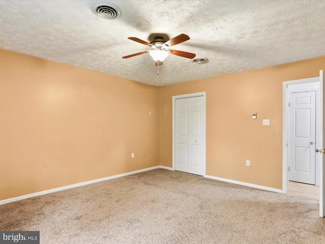 374 Tuscawilla Dr, Charles Town, WV 25414 - interior space featuring visible vents, baseboards, a ceiling fan, and a textured ceiling