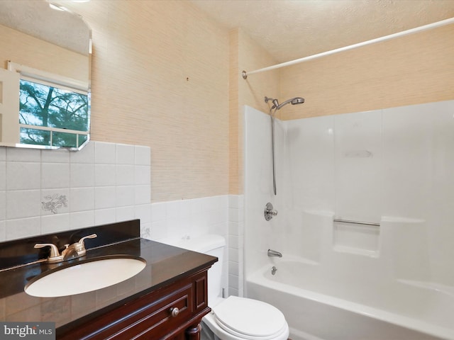 374 Tuscawilla Dr, Charles Town, WV 25414 - full bathroom featuring toilet, bathing tub / shower combination, vanity, and tile walls