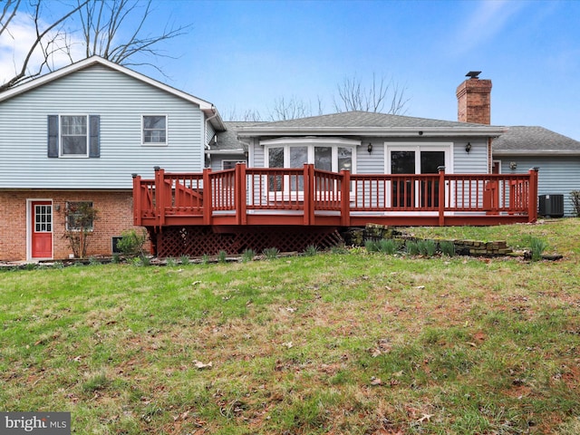 374 Tuscawilla Dr, Charles Town, WV 25414 - rear view of house featuring central AC, a lawn, brick siding, a chimney, and a deck