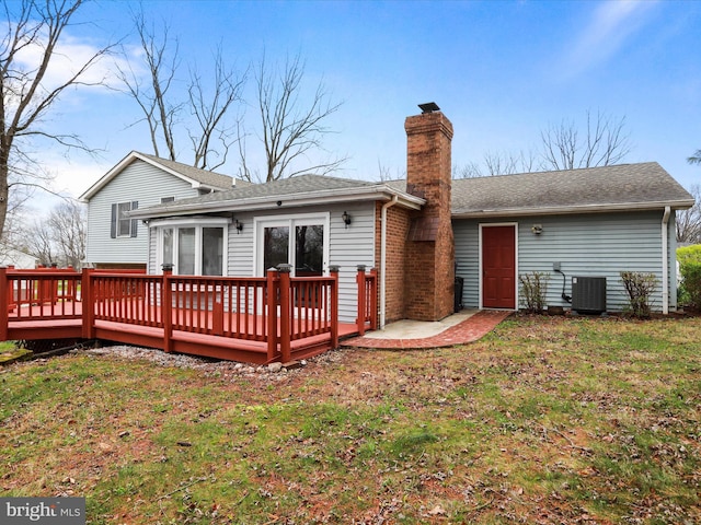 374 Tuscawilla Dr, Charles Town, WV 25414 - back of house with central AC, a wooden deck, a lawn, and a chimney