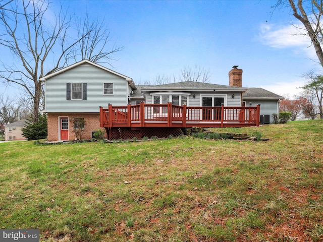 374 Tuscawilla Dr, Charles Town, WV 25414 - back of property featuring central air condition unit, a yard, brick siding, a chimney, and a deck