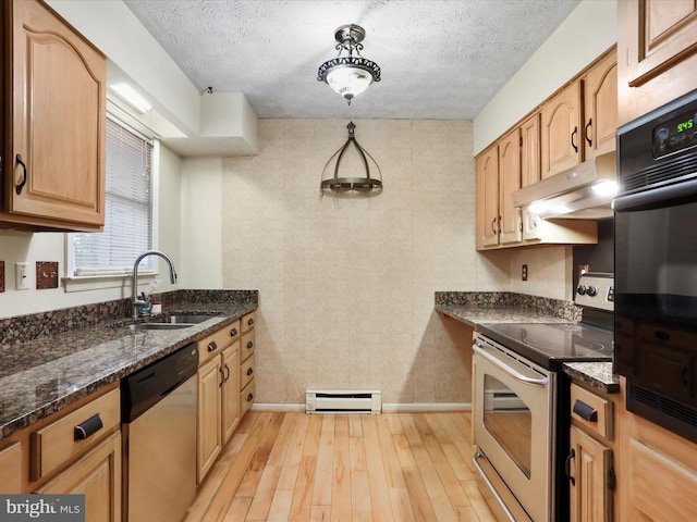 374 Tuscawilla Dr, Charles Town, WV 25414 - kitchen with light wood-type flooring, appliances with stainless steel finishes, under cabinet range hood, a sink, and a baseboard radiator