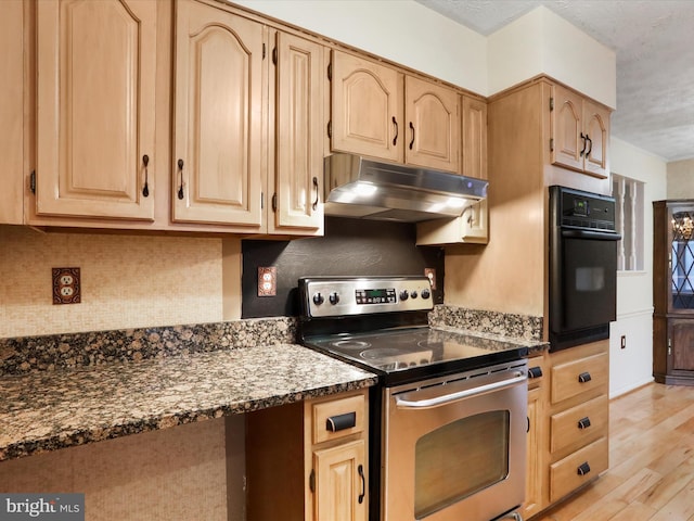374 Tuscawilla Dr, Charles Town, WV 25414 - kitchen featuring under cabinet range hood, light brown cabinetry, electric range, and oven