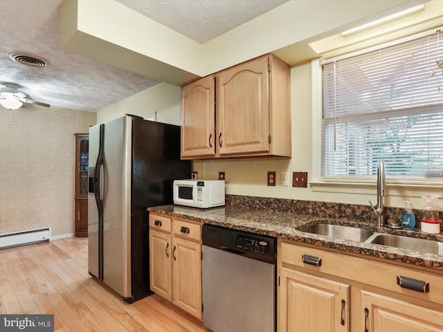 374 Tuscawilla Dr, Charles Town, WV 25414 - kitchen with light brown cabinetry, visible vents, a sink, stainless steel appliances, and light wood finished floors