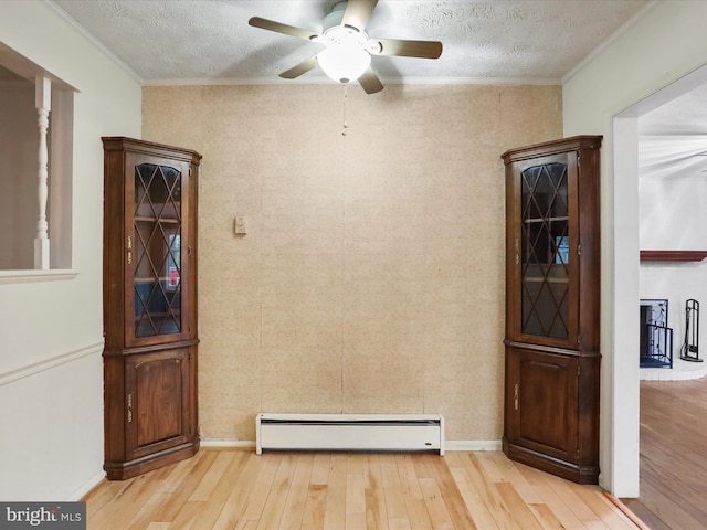 374 Tuscawilla Dr, Charles Town, WV 25414 - unfurnished dining area featuring light wood-style flooring, a textured ceiling, a baseboard heating unit, and ceiling fan