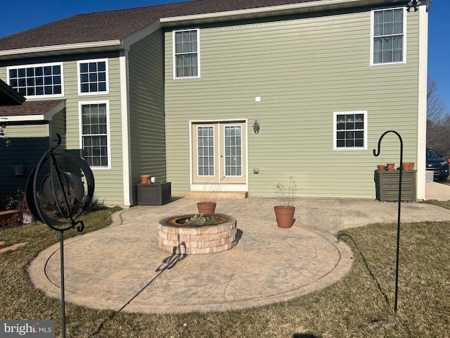 back of house with french doors, an outdoor fire pit, and a patio