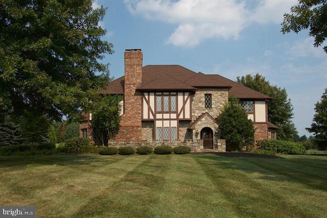 tudor house with a front lawn