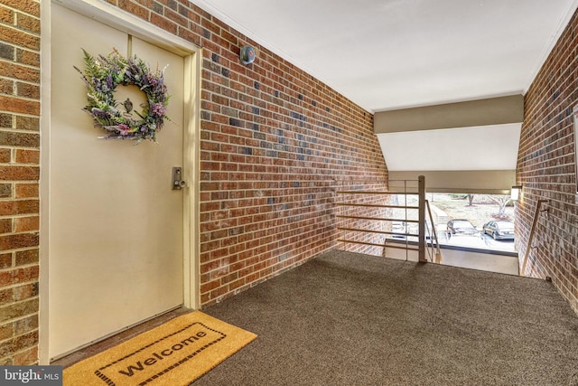 entrance to property with a balcony