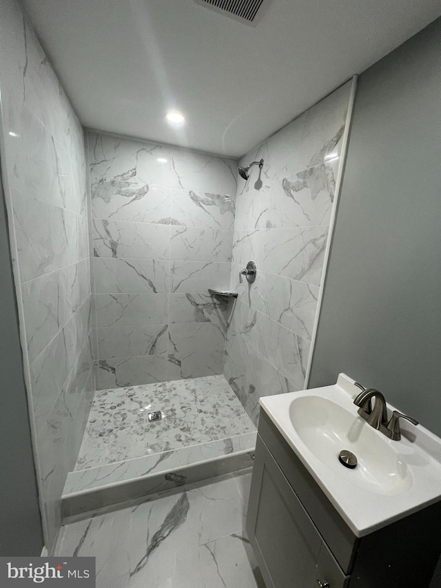 full bathroom with a shower stall, vanity, recessed lighting, and marble finish floor