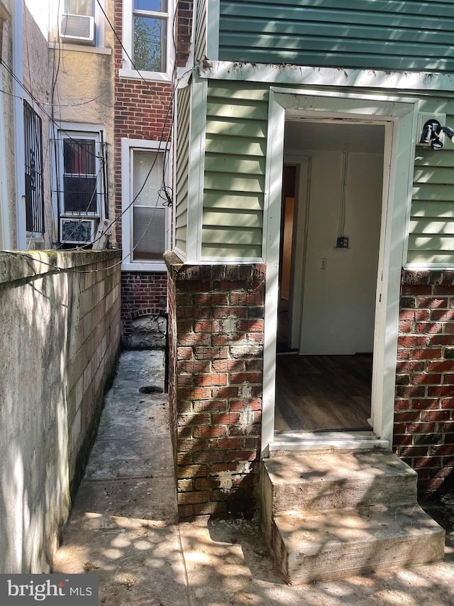 entrance to property with brick siding