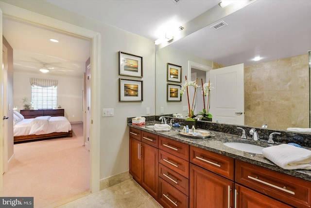 bathroom with tile patterned floors and vanity