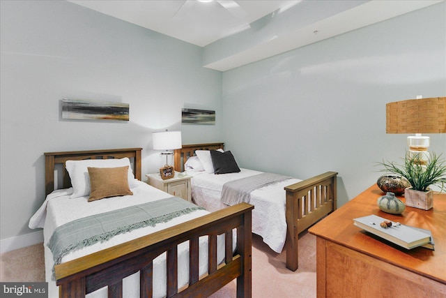 bedroom with ceiling fan and light carpet