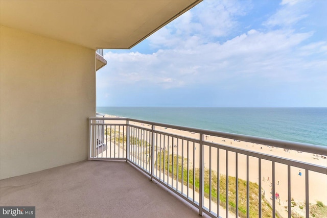 balcony with a beach view and a water view