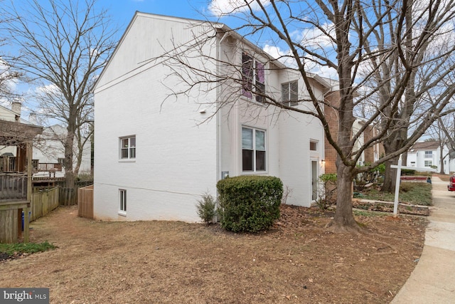 view of home's exterior featuring fence