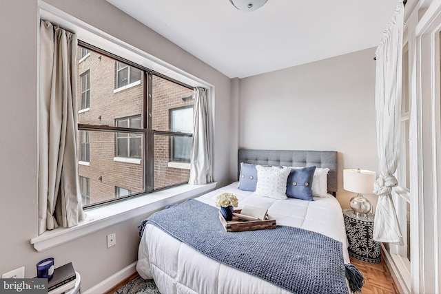 bedroom featuring baseboards