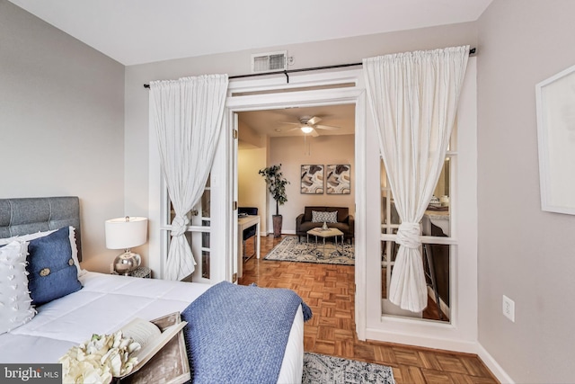 bedroom with visible vents and baseboards