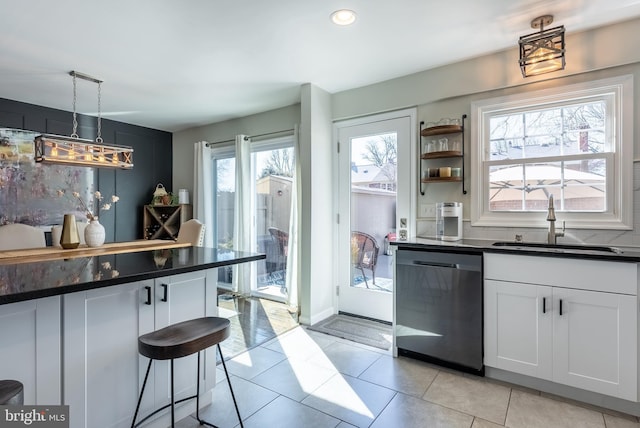 bar featuring pendant lighting, recessed lighting, light tile patterned flooring, a sink, and dishwasher