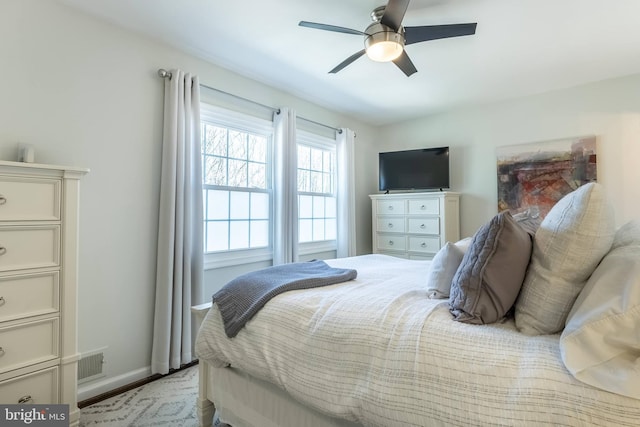 bedroom featuring visible vents, baseboards, and a ceiling fan