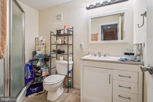 full bathroom featuring toilet, vanity, visible vents, tile patterned floors, and a stall shower