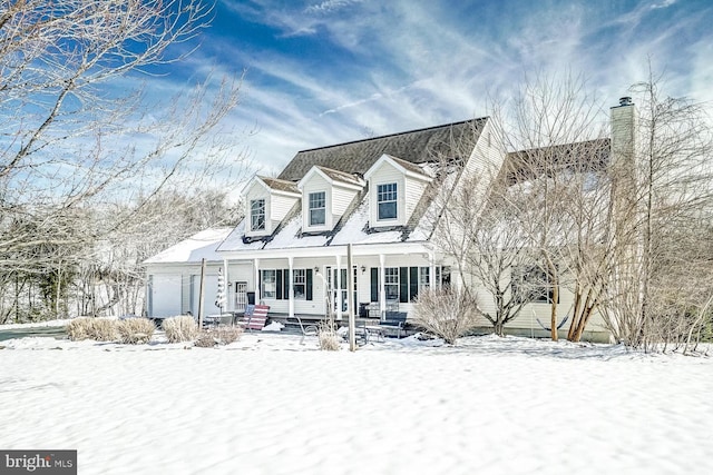 cape cod-style house with an attached garage