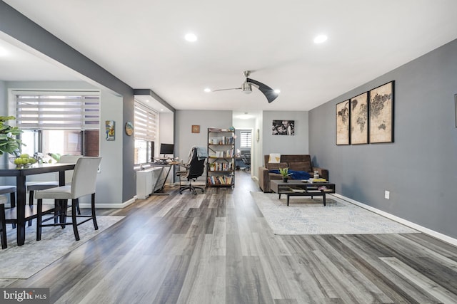 interior space featuring ceiling fan and wood-type flooring