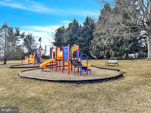 community jungle gym with a lawn