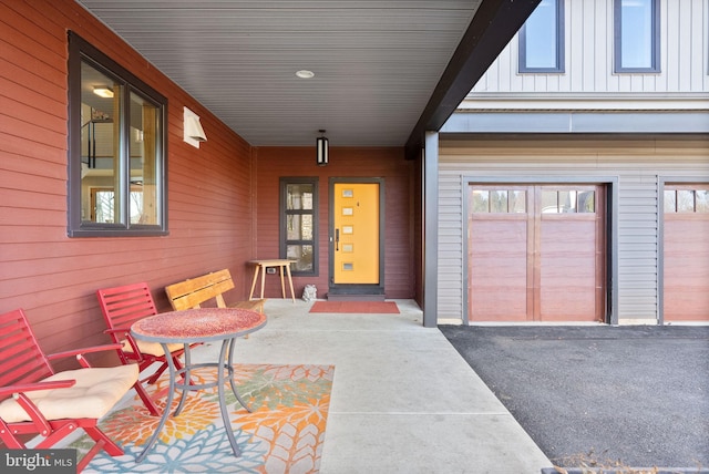 property entrance with a porch and board and batten siding