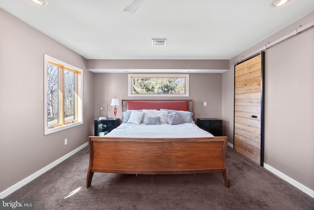 carpeted bedroom featuring visible vents and baseboards