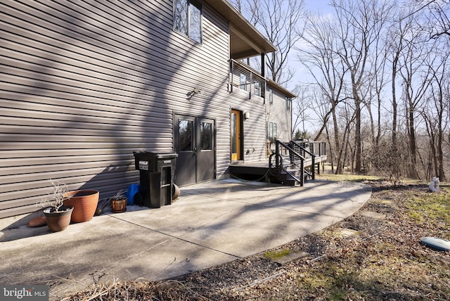 view of property exterior featuring a patio