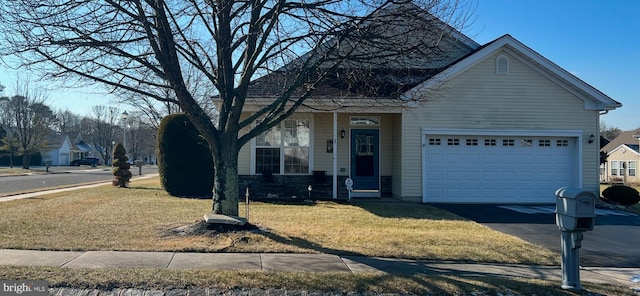 view of front facade featuring a garage and a front lawn