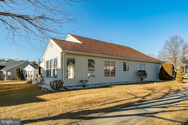 view of home's exterior featuring a yard