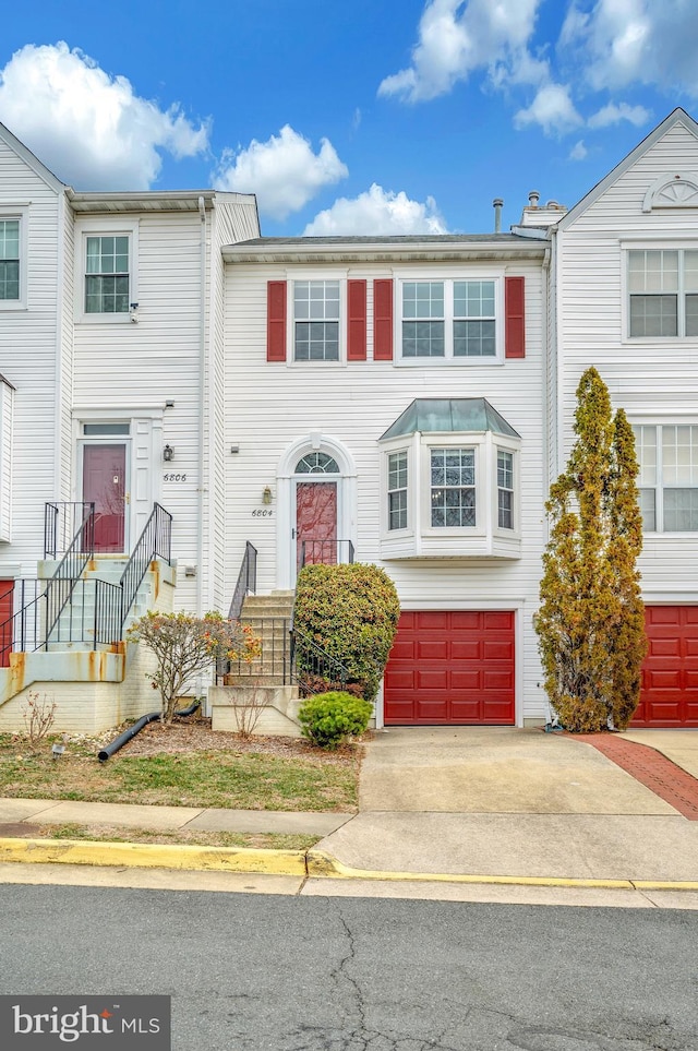 multi unit property featuring a garage