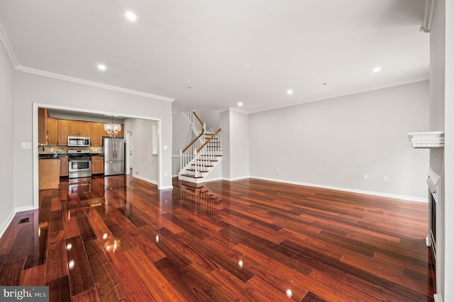 unfurnished living room featuring ornamental molding and dark wood-type flooring