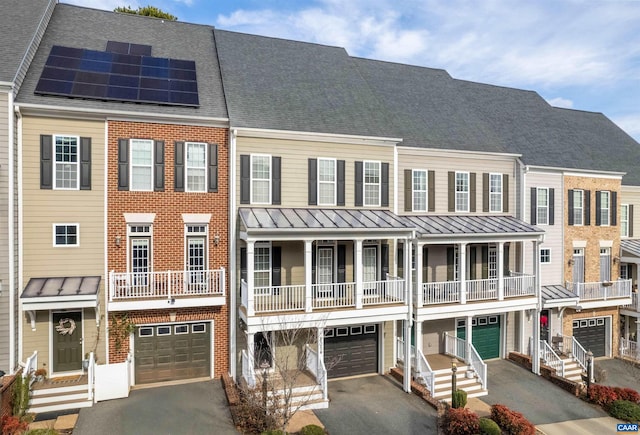 view of property with a garage and solar panels