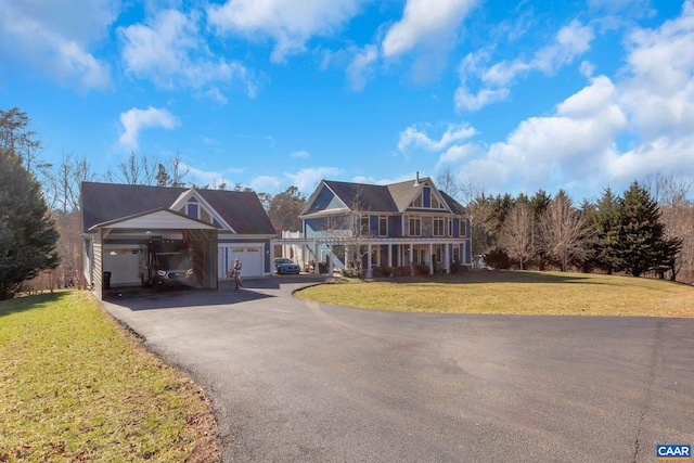 view of front of property with a garage and a front lawn