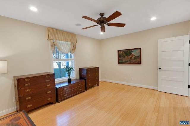 interior space with ceiling fan and light hardwood / wood-style flooring