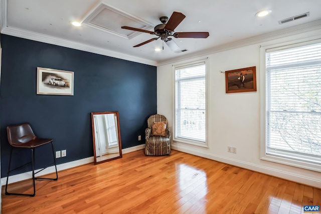 sitting room with crown molding, light hardwood / wood-style floors, and ceiling fan