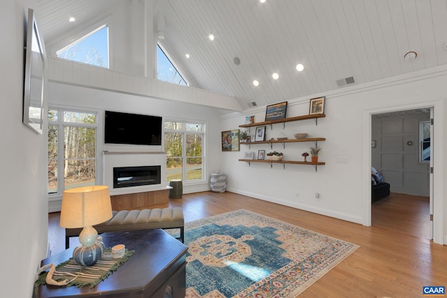 living room with high vaulted ceiling, wooden ceiling, and light wood-type flooring