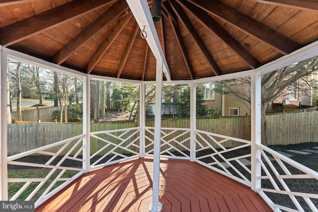 wooden terrace with a gazebo and fence