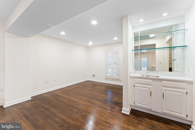 bar featuring recessed lighting, dark wood finished floors, and baseboards