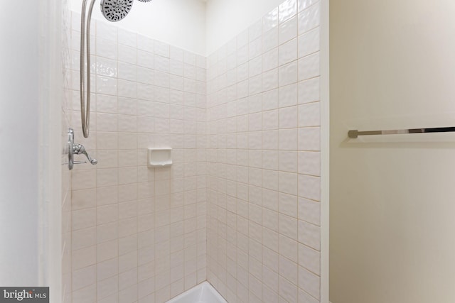 full bath featuring tiled shower