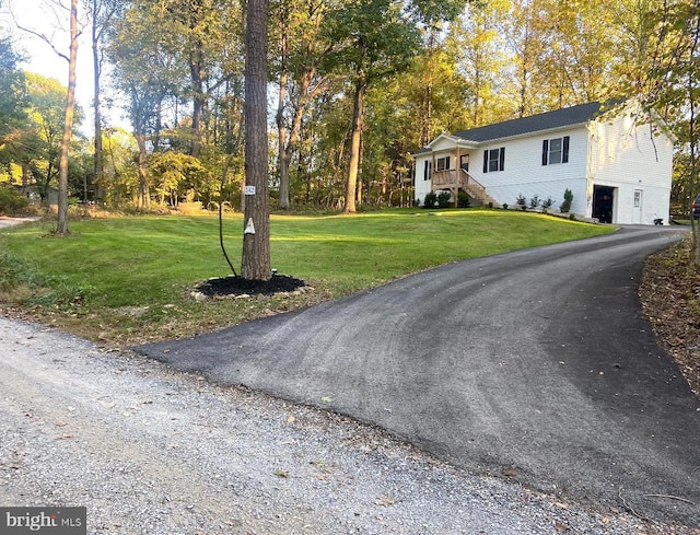 exterior space featuring driveway and stairs