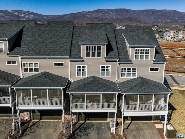 back of property featuring a mountain view