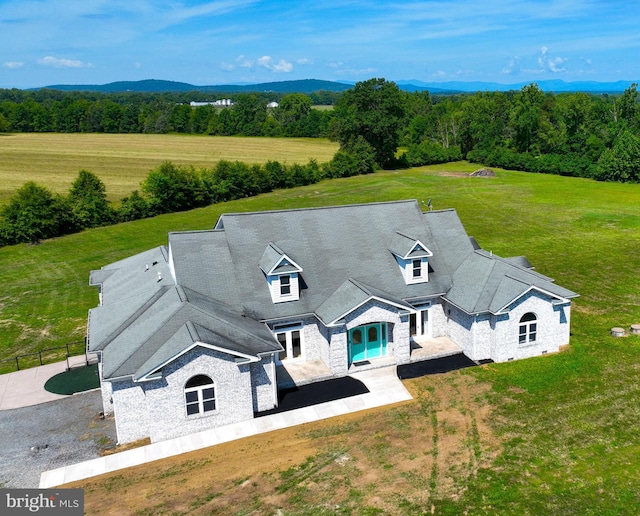 birds eye view of property featuring a wooded view