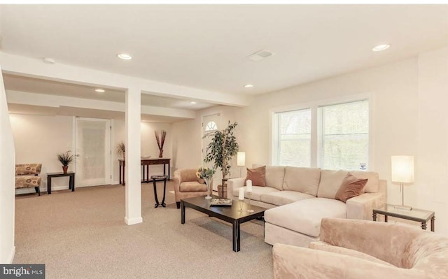 living room featuring light carpet