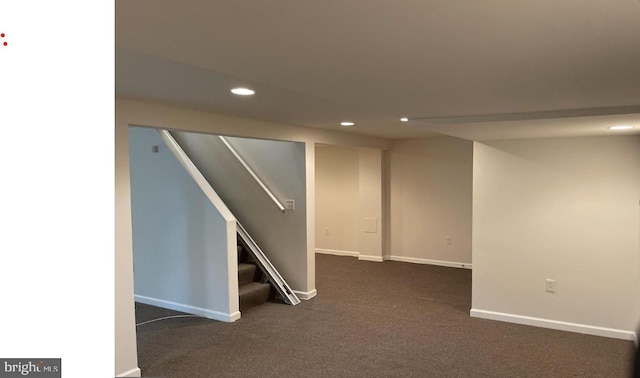 basement with dark carpet